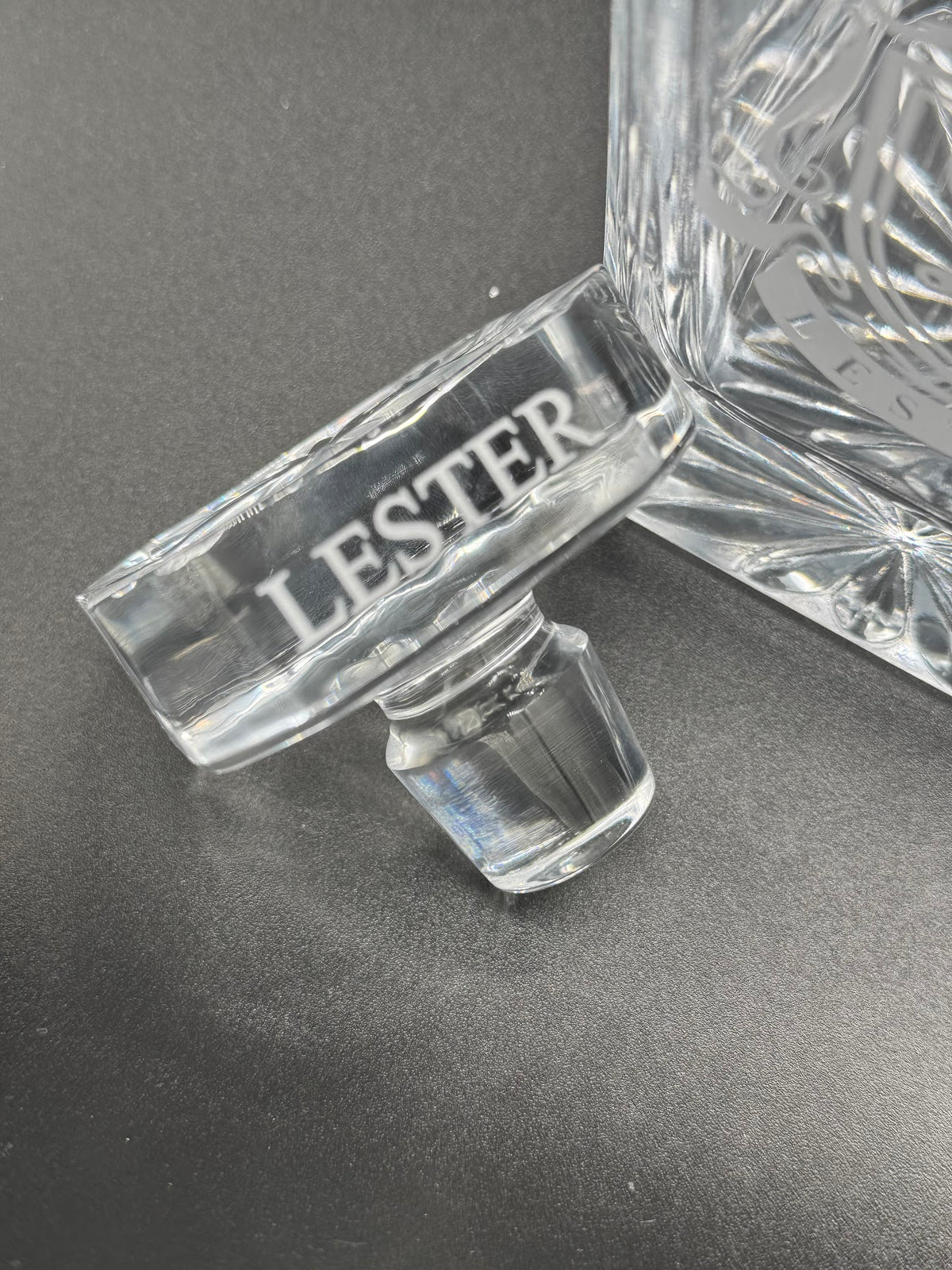 Close-up of personalized engraved decanter stopper